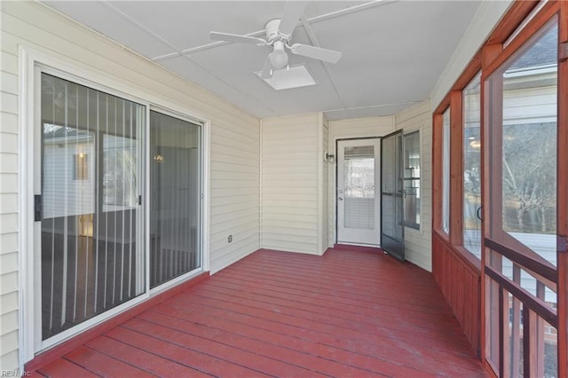 sunroom featuring ceiling fan