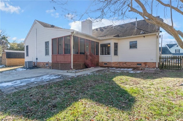 rear view of property with central AC, a sunroom, a yard, and a patio