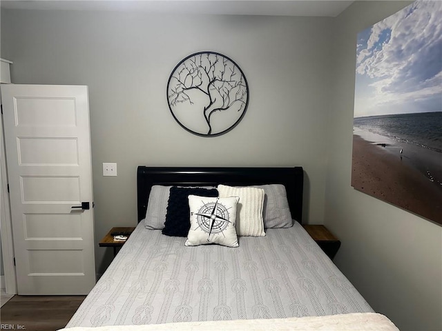 bedroom with wood-type flooring