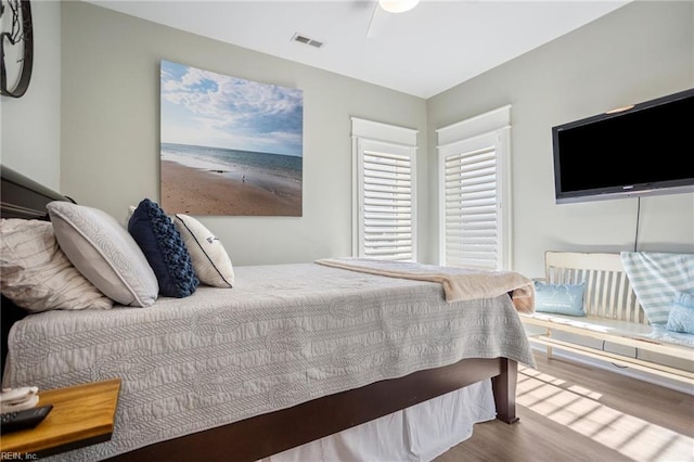 bedroom with wood-type flooring and ceiling fan