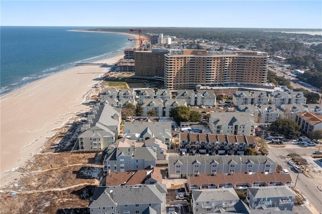 birds eye view of property featuring a beach view and a water view