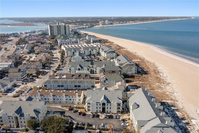 aerial view with a view of the beach and a water view