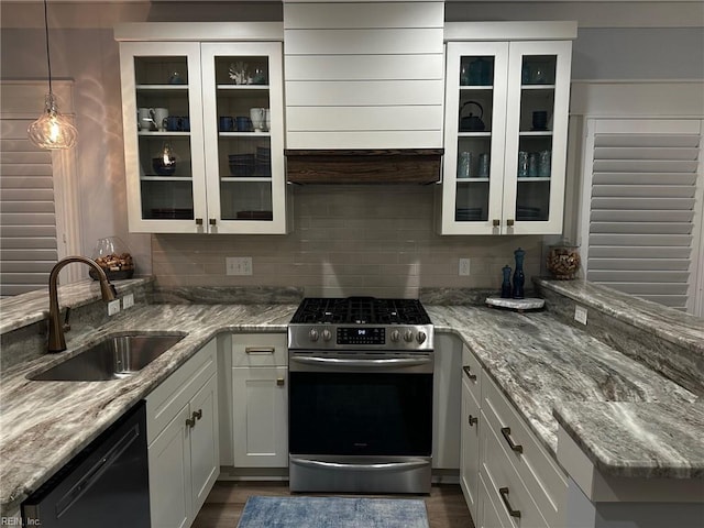 kitchen featuring sink, white cabinetry, black dishwasher, light stone countertops, and gas stove