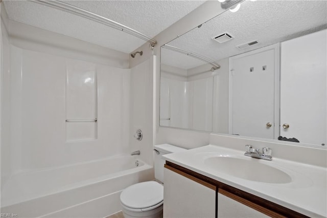 full bathroom featuring a textured ceiling, toilet, vanity, and bathing tub / shower combination