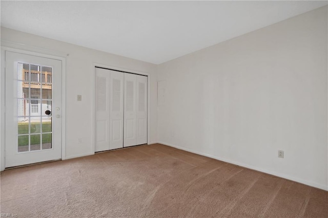 unfurnished bedroom featuring a closet and carpet flooring