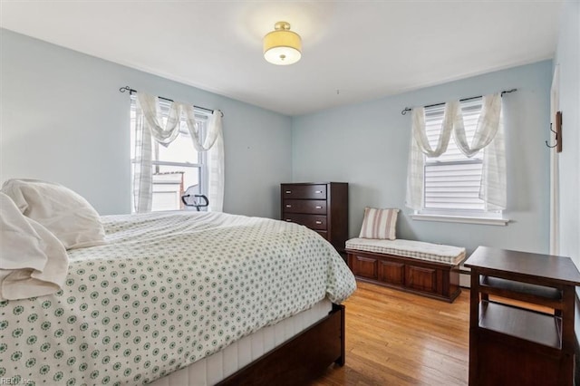 bedroom with light hardwood / wood-style flooring