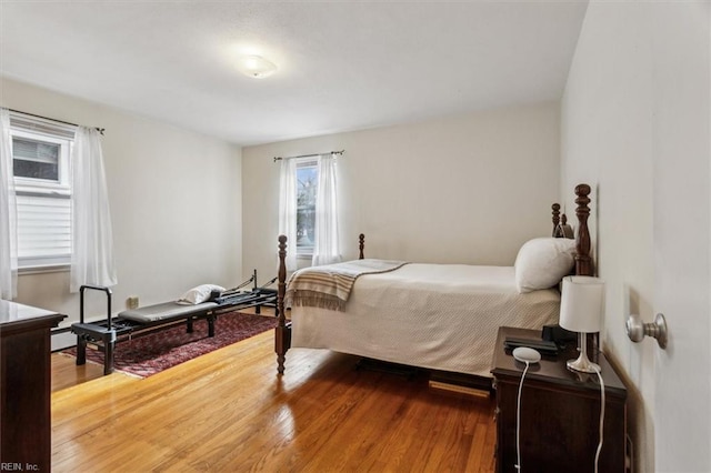 bedroom with hardwood / wood-style floors