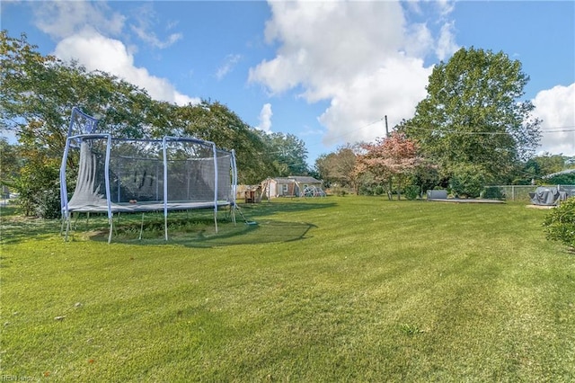 view of yard with a trampoline