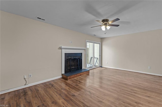 unfurnished living room with ceiling fan and wood-type flooring