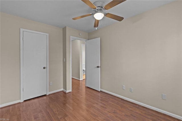 unfurnished bedroom featuring wood-type flooring and ceiling fan