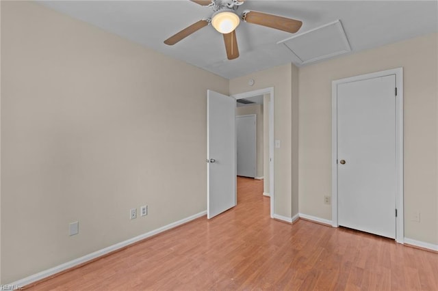 unfurnished bedroom with ceiling fan and light hardwood / wood-style floors