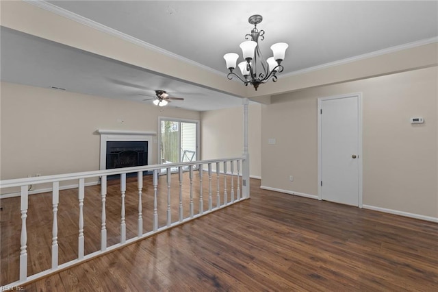 unfurnished room with crown molding, dark hardwood / wood-style flooring, and ceiling fan with notable chandelier