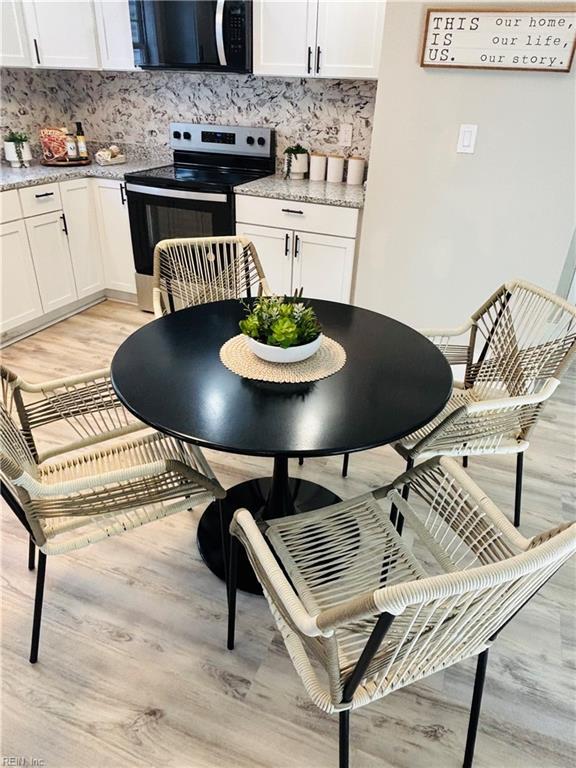 dining area with light wood-type flooring