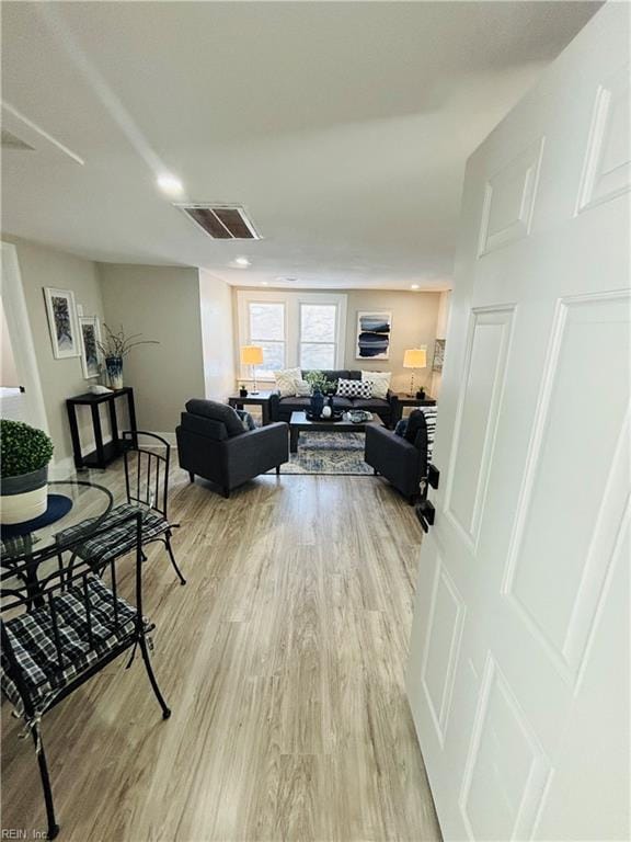 living room with light hardwood / wood-style floors