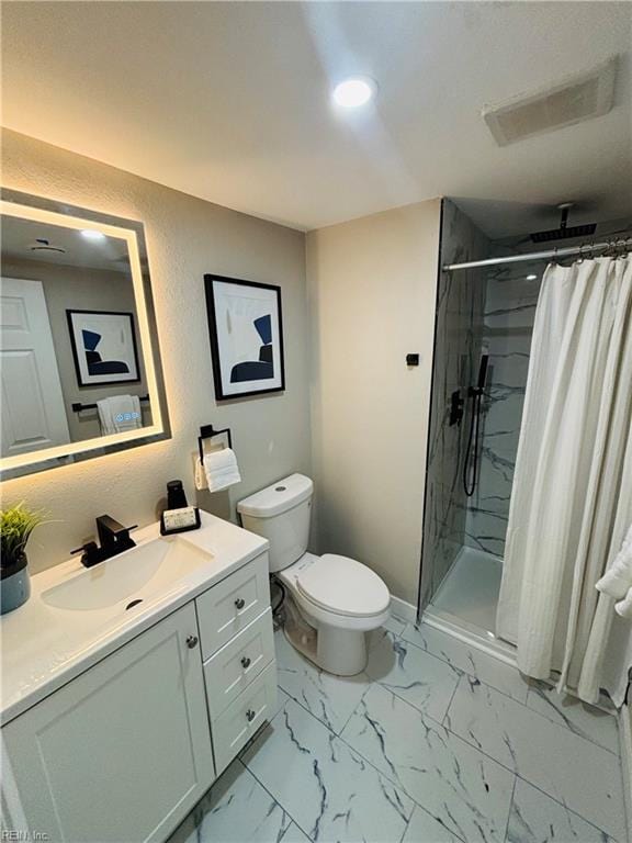 bathroom featuring a shower with curtain, toilet, and vanity