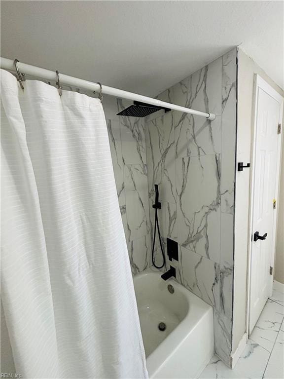 bathroom with shower / bath combo with shower curtain