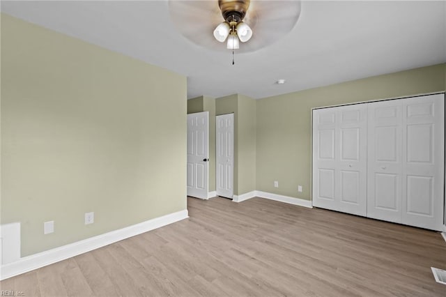 unfurnished bedroom featuring light hardwood / wood-style flooring and ceiling fan