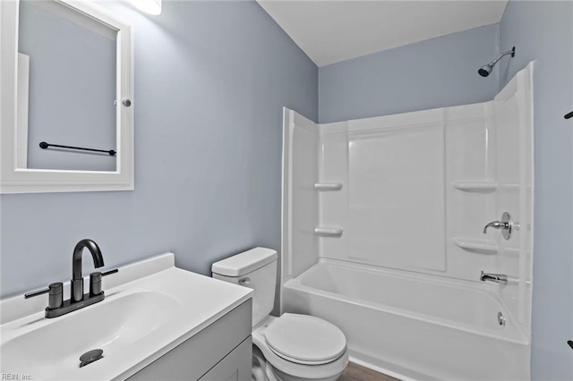 full bathroom featuring vanity, tub / shower combination, and toilet