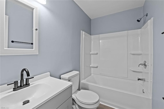 full bathroom featuring vanity,  shower combination, and toilet