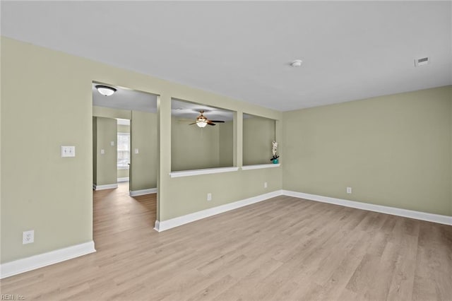 unfurnished room featuring light hardwood / wood-style floors and ceiling fan