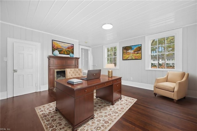 office space with dark wood-type flooring, crown molding, and plenty of natural light