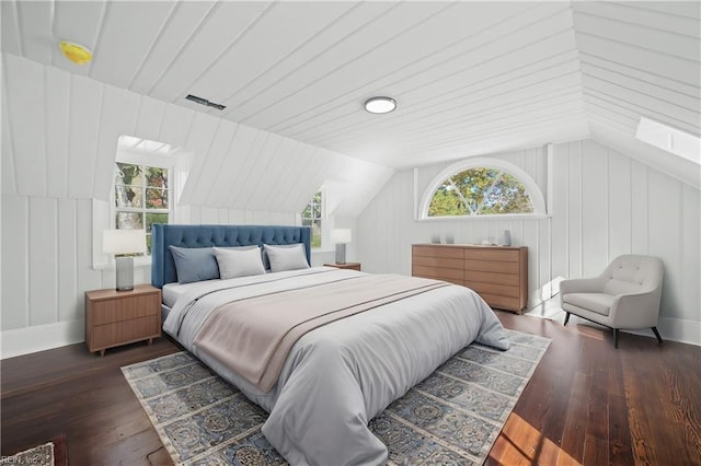 bedroom featuring dark hardwood / wood-style floors and vaulted ceiling