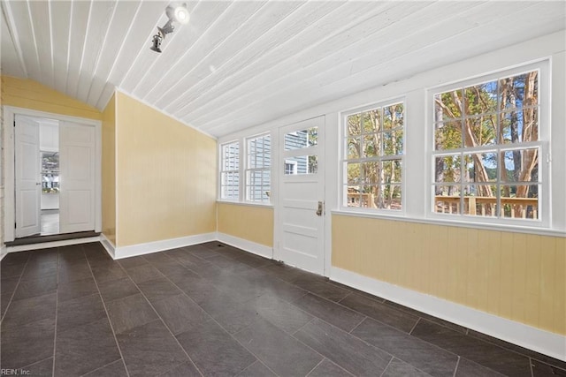 unfurnished sunroom with vaulted ceiling