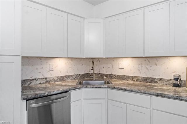 kitchen featuring sink, white cabinetry, and stainless steel dishwasher