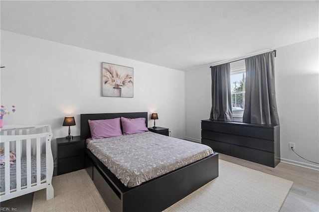 bedroom with light hardwood / wood-style flooring