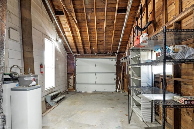 garage featuring wooden ceiling and wooden walls