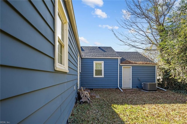 rear view of property with central AC unit