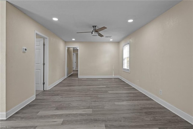 empty room featuring ceiling fan and light wood-type flooring