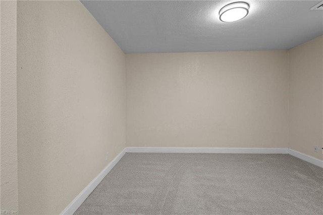 unfurnished room featuring carpet