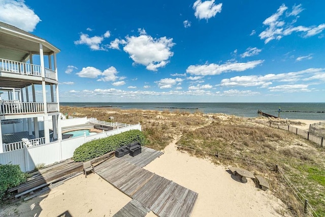 property view of water featuring a beach view