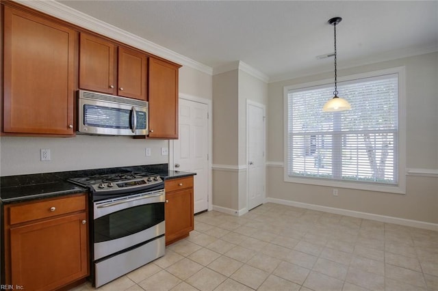 kitchen featuring stainless steel appliances, ornamental molding, hanging light fixtures, and plenty of natural light