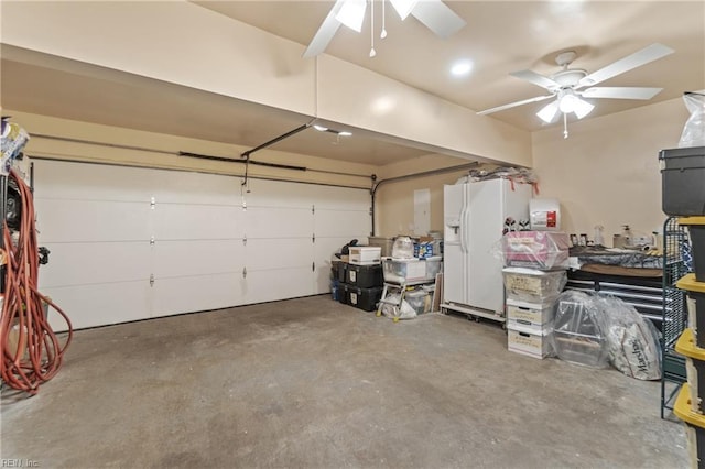 garage with ceiling fan and white refrigerator with ice dispenser