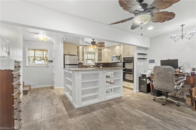 office featuring light wood-type flooring and ceiling fan