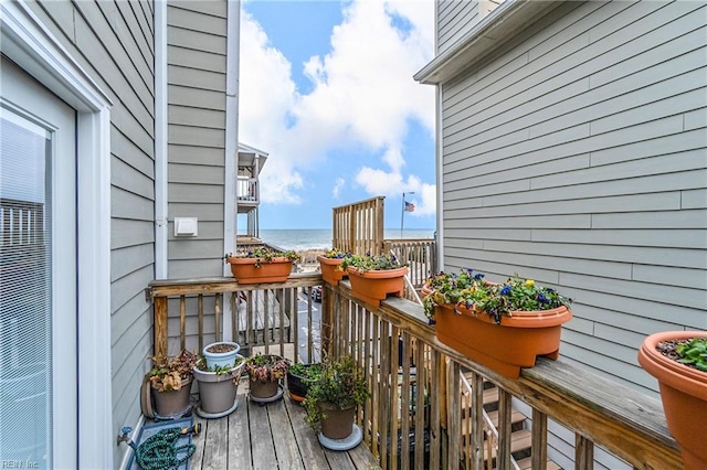 balcony featuring a water view