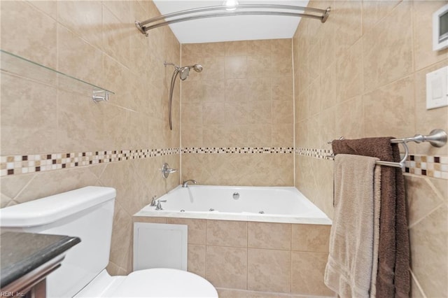 bathroom featuring tiled shower / bath combo, toilet, and tile walls