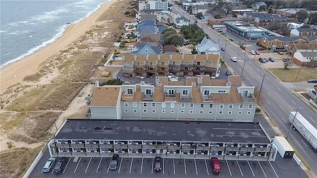 aerial view with a water view and a view of the beach