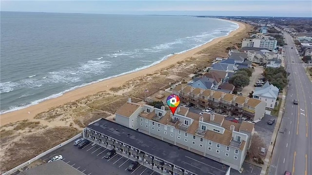 bird's eye view with a water view and a view of the beach