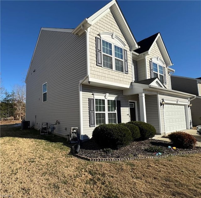 view of front of house featuring a garage, central air condition unit, and a front yard