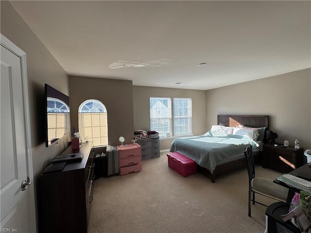 bedroom with light colored carpet