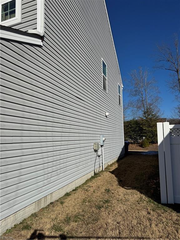 view of home's exterior with a lawn