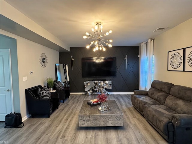 living room featuring hardwood / wood-style floors and a chandelier