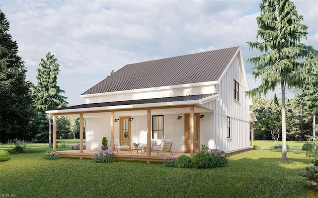 back of house featuring covered porch and a yard