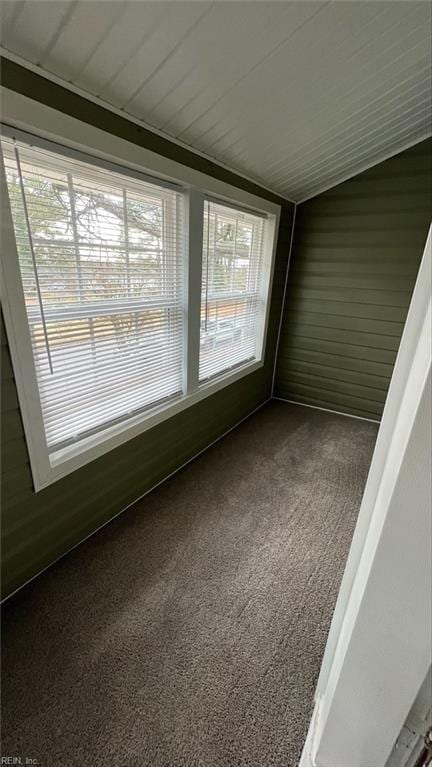 unfurnished sunroom with lofted ceiling