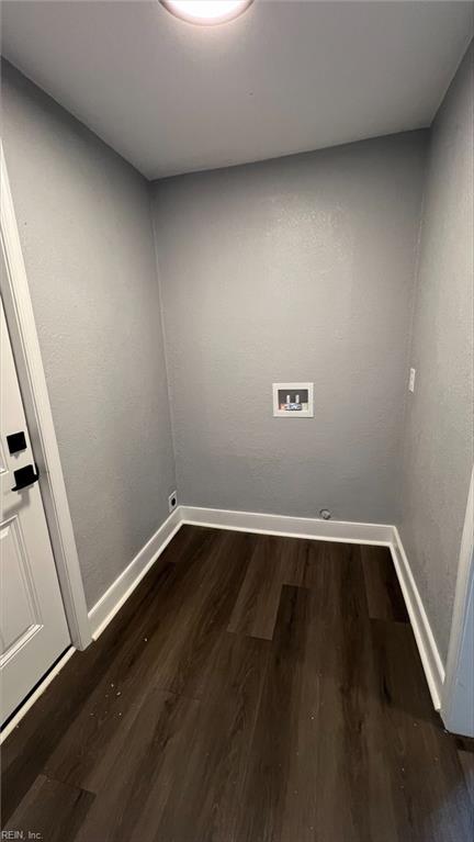 laundry room featuring washer hookup and dark hardwood / wood-style flooring