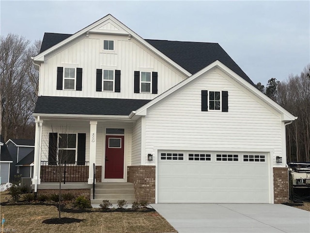 view of front of property with a porch and a garage