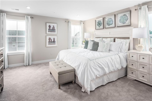 bedroom featuring light colored carpet